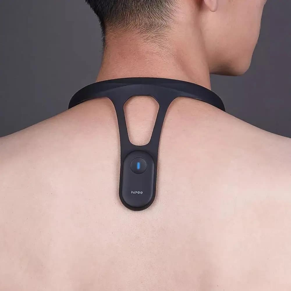 Realign Pulse Smart Posture Trainer — worn on upper back